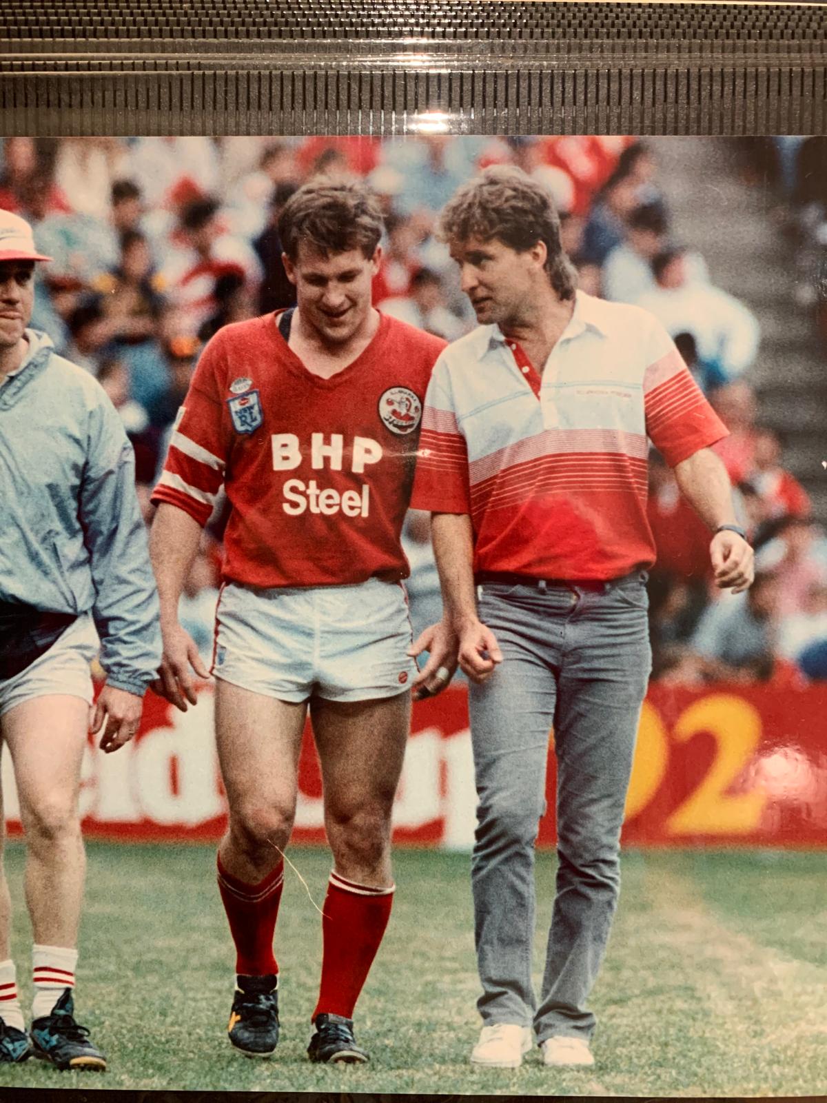 An early-career photograph of Dr Mark Jones on a rugby league field